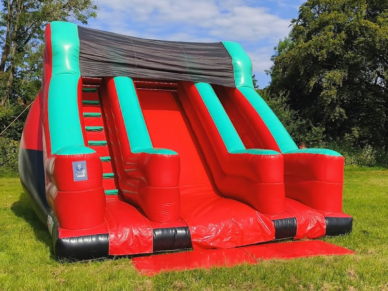 Twin climb and slide bouncy castle hire